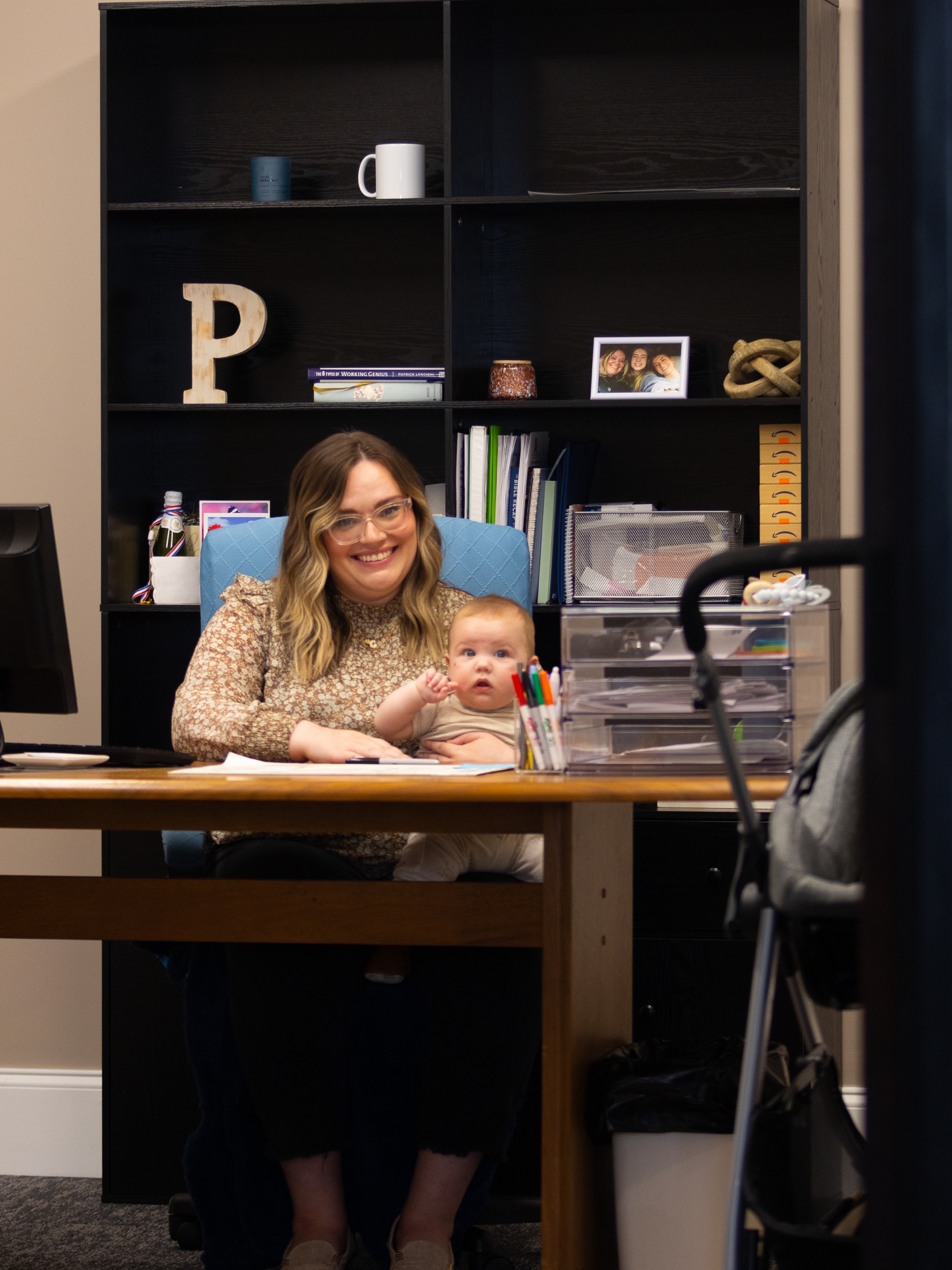 A New Hope Kids caregiver holding a baby with attentive care