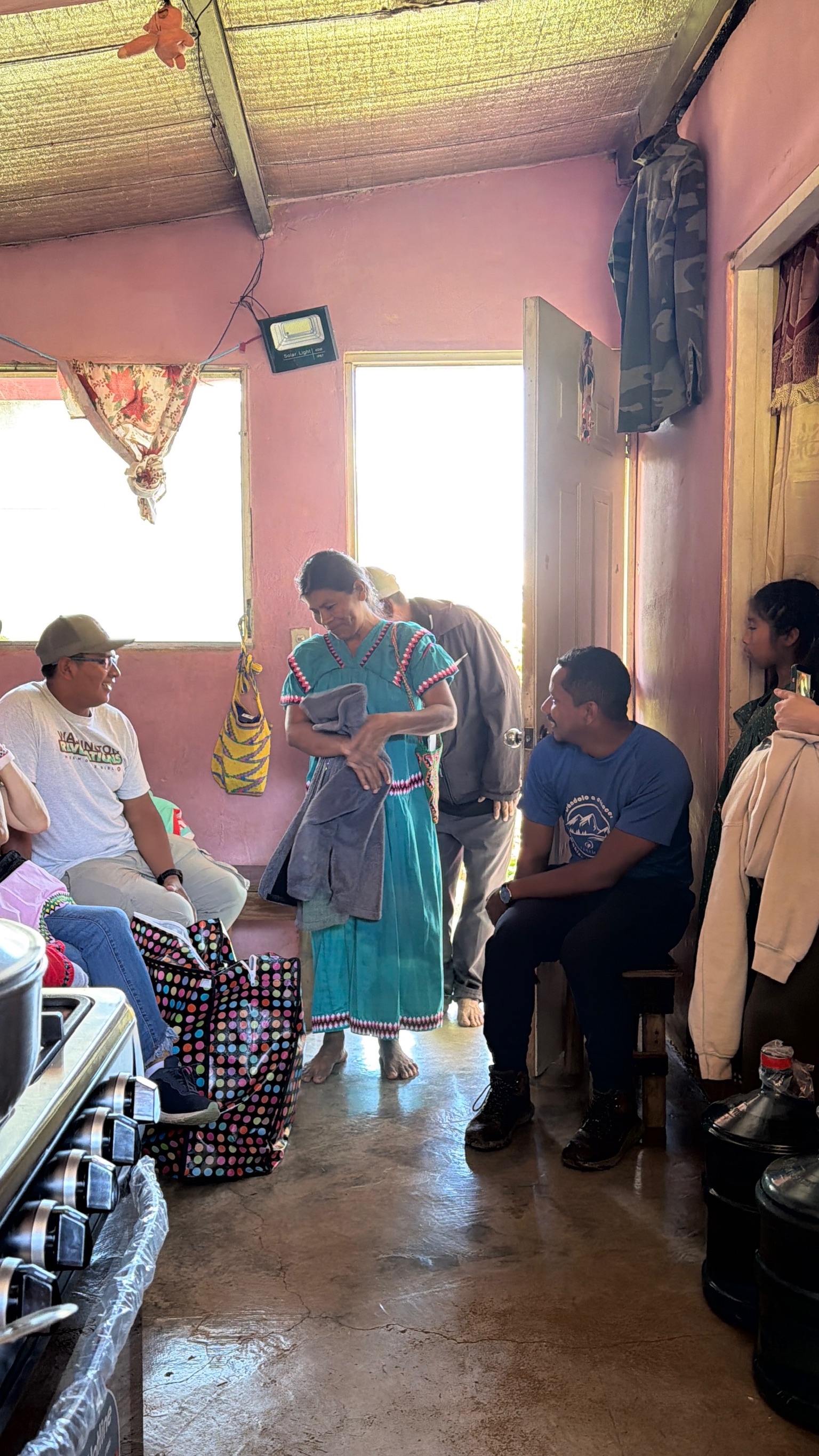 Panama home visit and prayer moment.