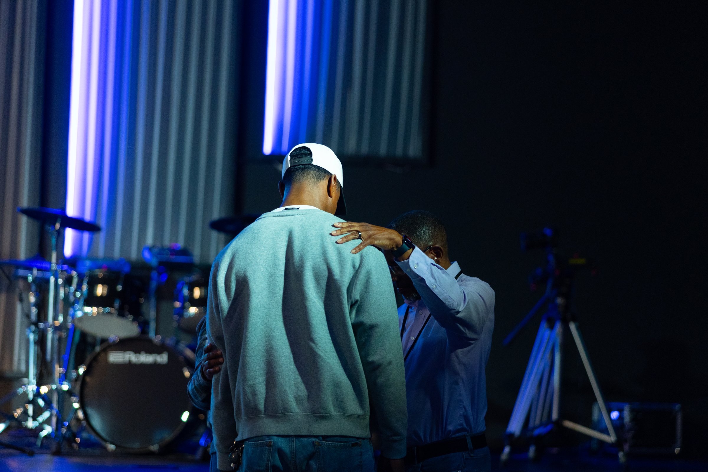 A small group praying together at New Hope