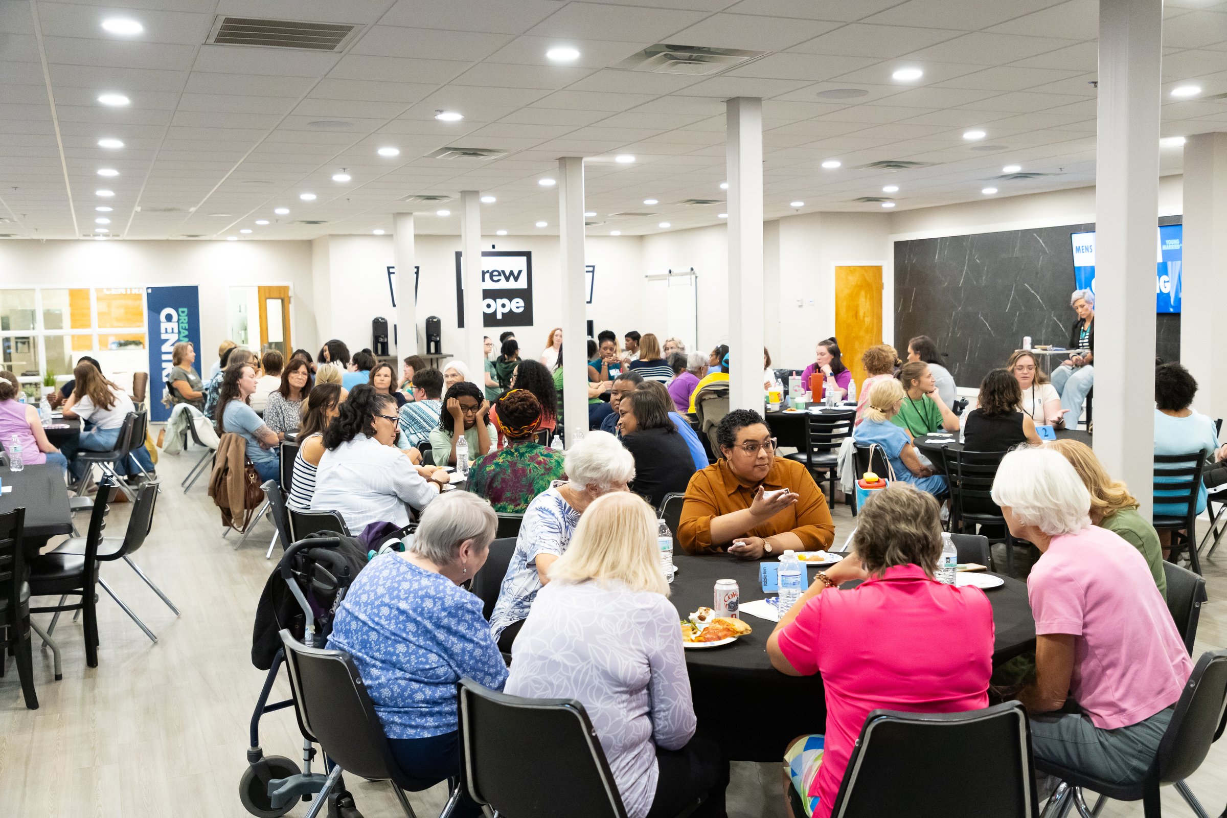 Women sharing conversation at a New Hope Gathering
