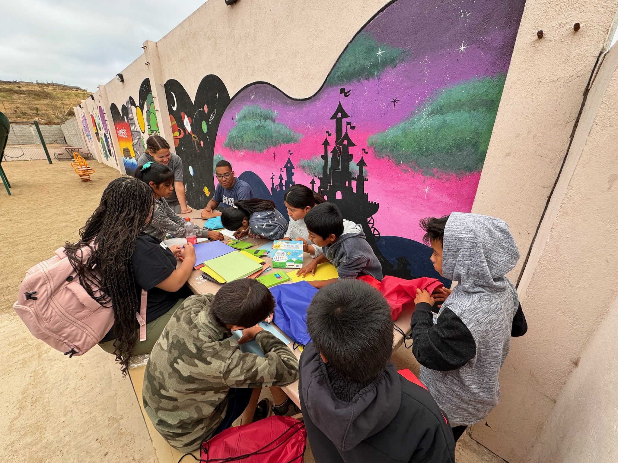 Children and team members at a craft table in Baja, Mexico