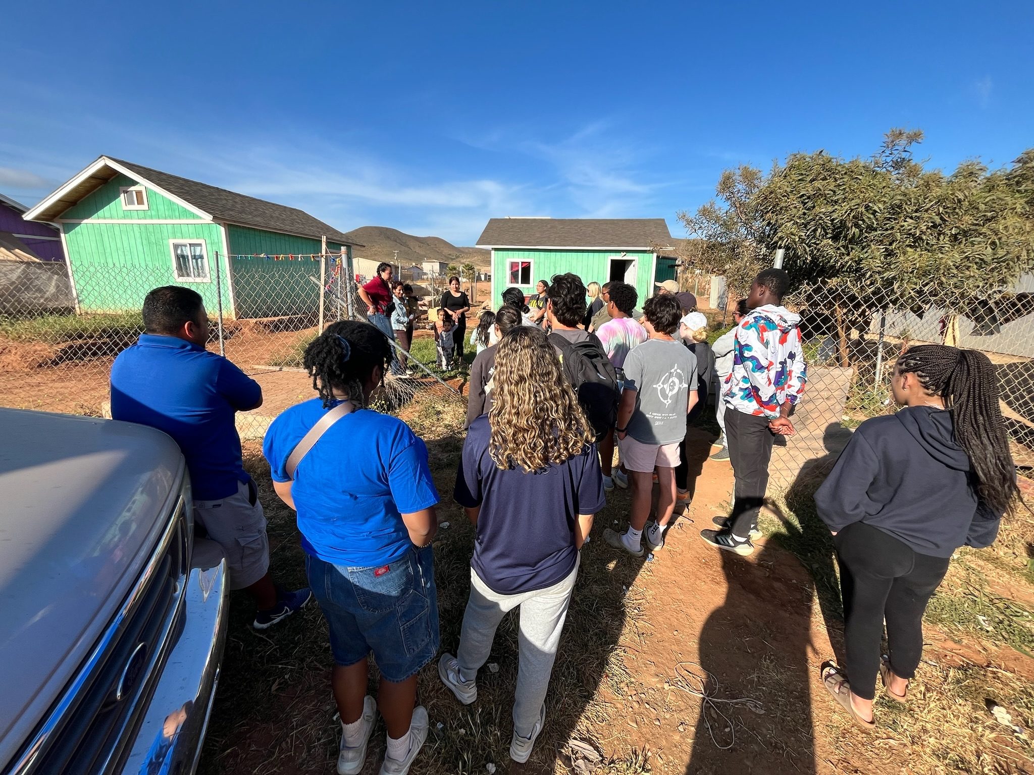 New Hope team gathered at newly built homes in Baja, Mexico
