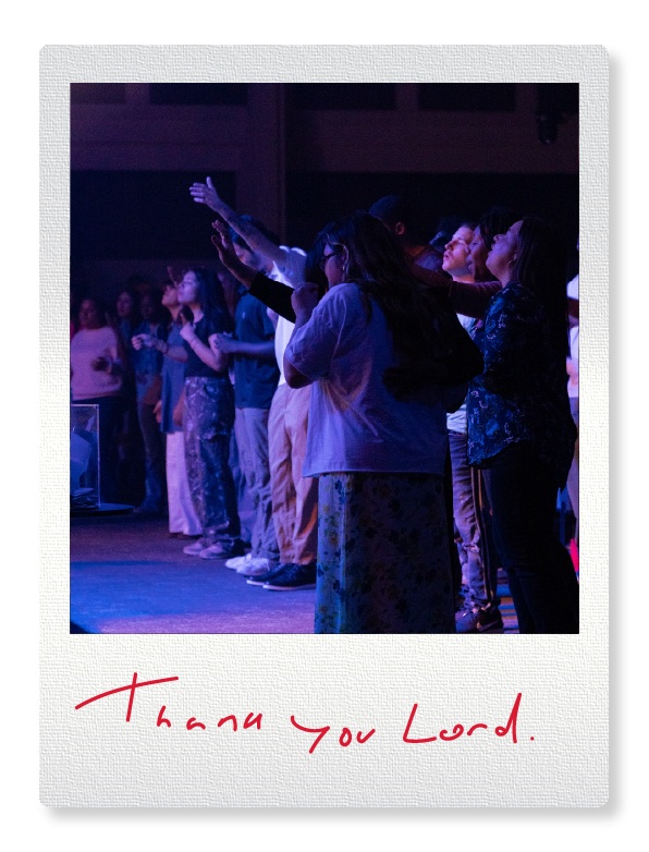 People worshiping and praying before a relief effort