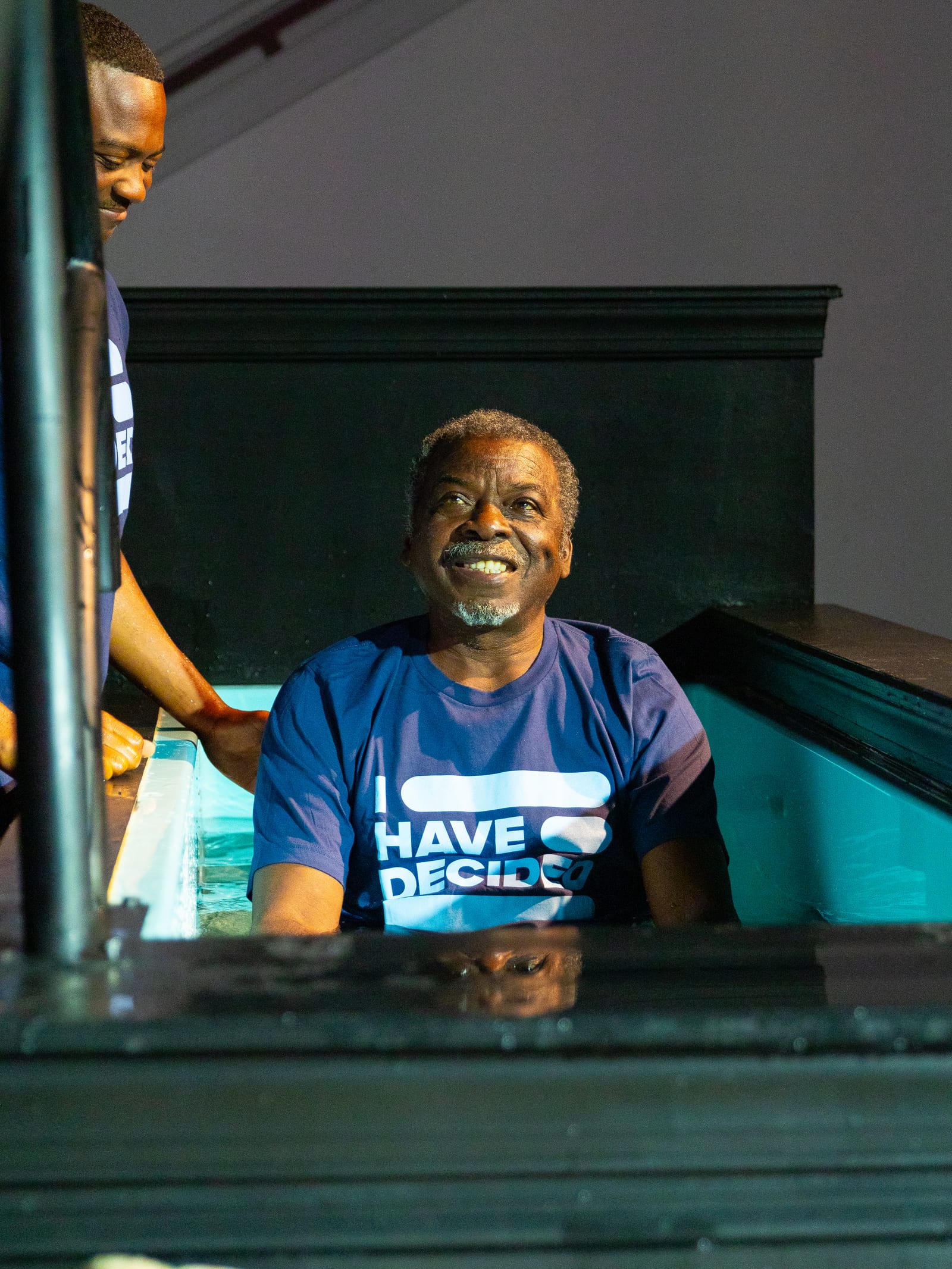 A man smiling during his baptism celebration at New Hope
