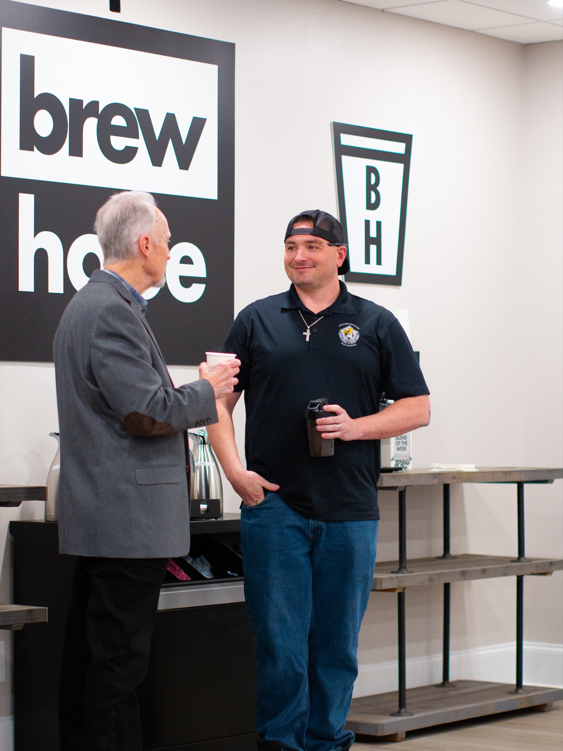 Two men connecting over coffee at New Hope